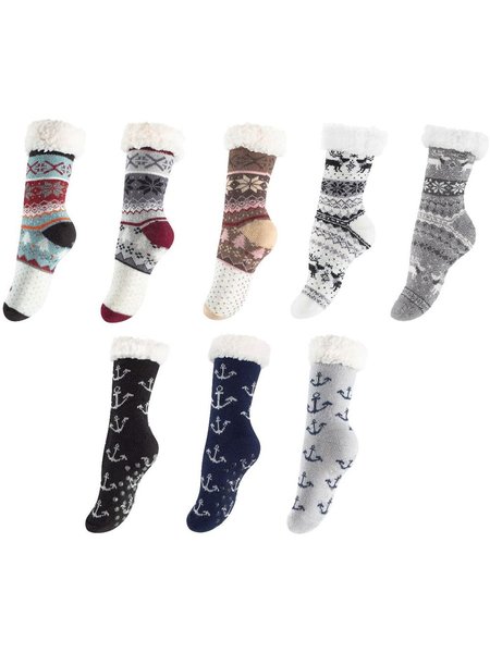 Socks with different motifs and ABS sole